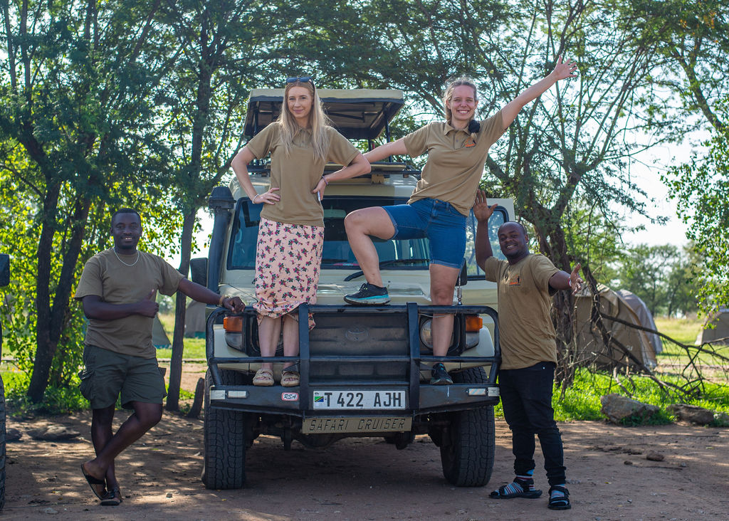 Elephant herd walking across an open safari plain